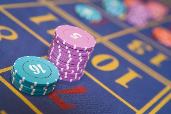 ajo live-dealer studio with multi-camera blackjack table and mobile app interface